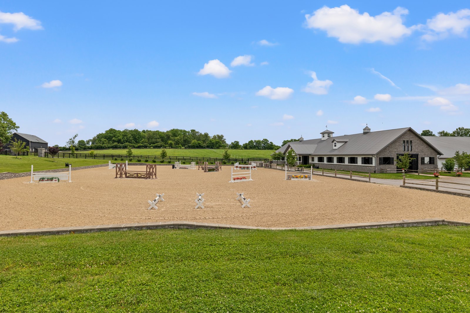 The outdoor GGT-footed arena and barn at Avalon at Cherry Knoll Farm